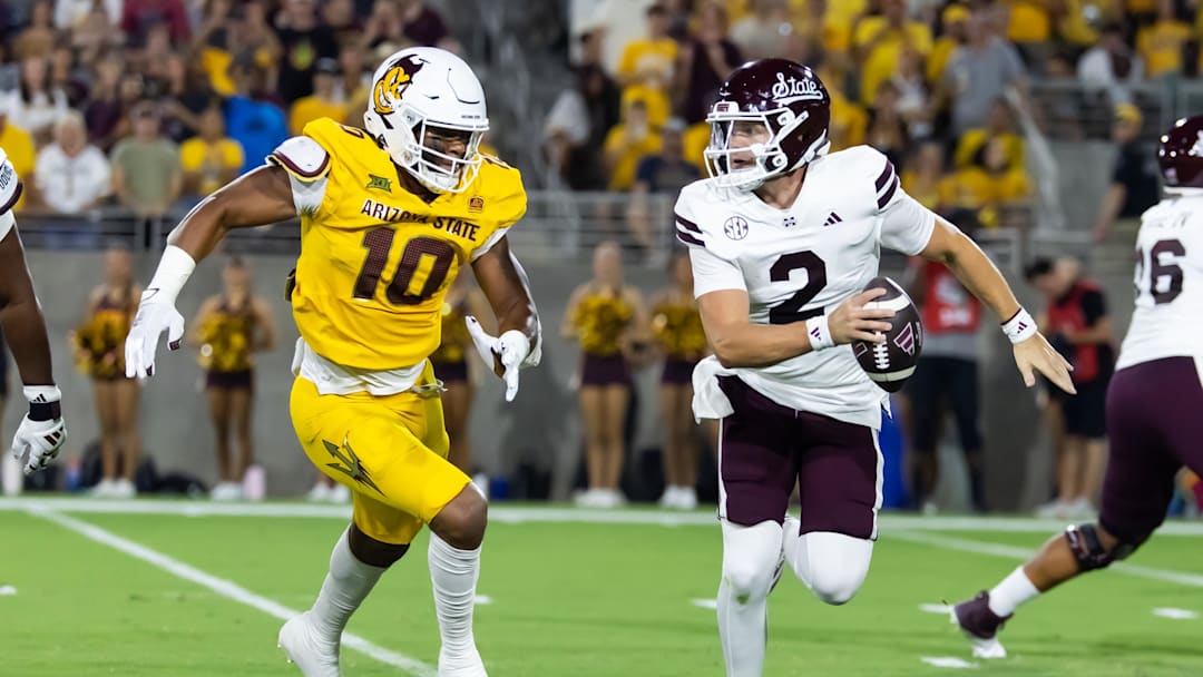 Sep 7, 2024; Tempe, Arizona, USA; Mississippi State Bulldogs quarterback Blake Shapen (2) is pursued by Arizona State Sun Devils defensive lineman Clayton Smith (10) at Mountain America Stadium. Mandatory Credit: Mark J. Rebilas-Imagn Images