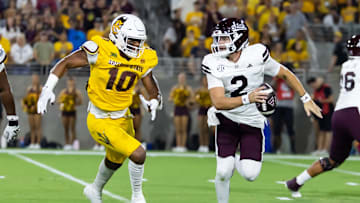 Sep 7, 2024; Tempe, Arizona, USA; Mississippi State Bulldogs quarterback Blake Shapen (2) is pursued by Arizona State Sun Devils defensive lineman Clayton Smith (10) at Mountain America Stadium. Mandatory Credit: Mark J. Rebilas-Imagn Images