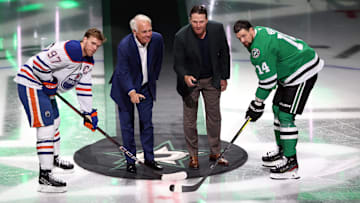 Oct 19, 2024; Dallas, Texas, USA; Dallas Stars former president Jim Lites and Stars former player Brenden Morrow drop a ceremonial puck with Edmonton Oilers center Connor McDavid (97) and Dallas Stars left wing Jamie Benn (14) before a game at American Airlines Center. Mandatory Credit: Tim Heitman-Imagn Images