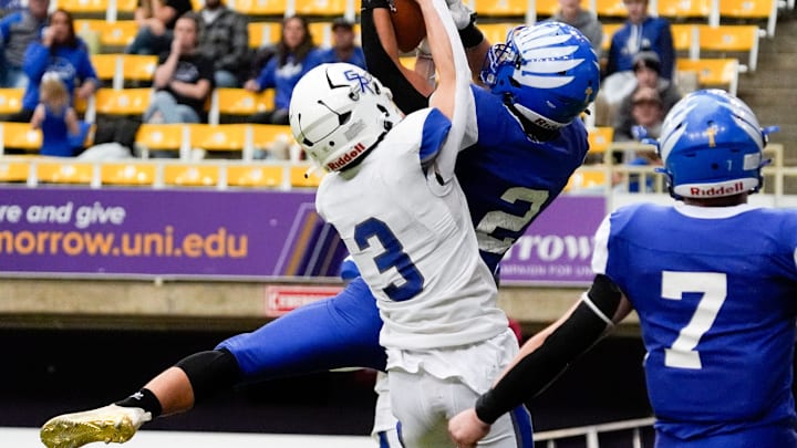 Remsen St. Mary's Keaton Harpenau (2) intercept’s a pass meant for Gladbrook-Reinbeck’s Hudson Clark (3) during the Iowa high school 8-player championship Thursday, Nov. 21, 2024 at the UNI-Dome in Cedar Falls, Iowa.
