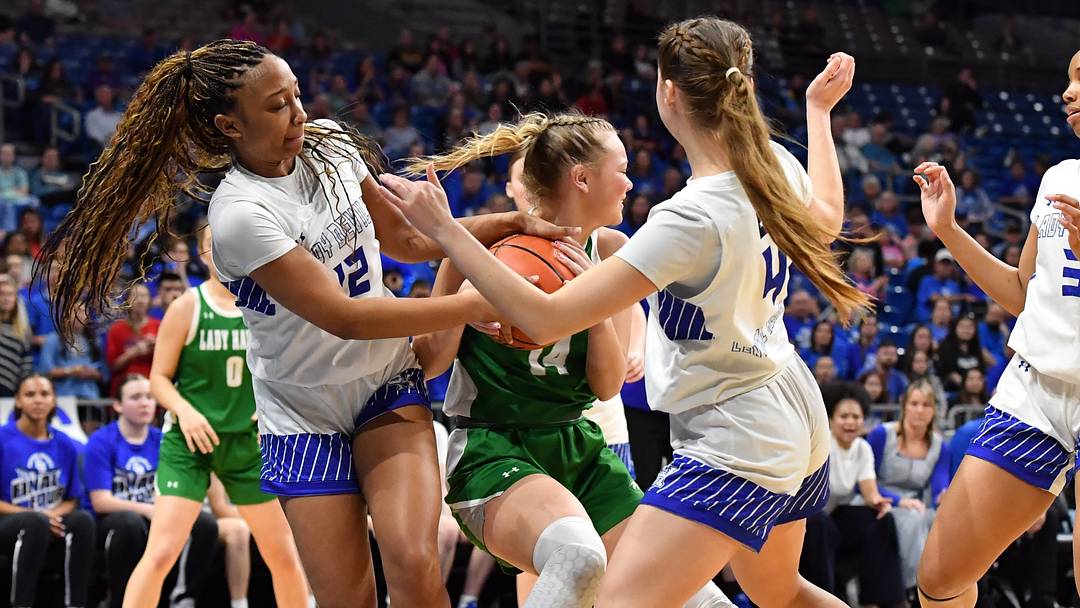 Wall's Emery Harper battles Central Heights defenders during the 3A DII UIL girls basketball state championship game, on Friday, March 6, 2026, in San Antonio.