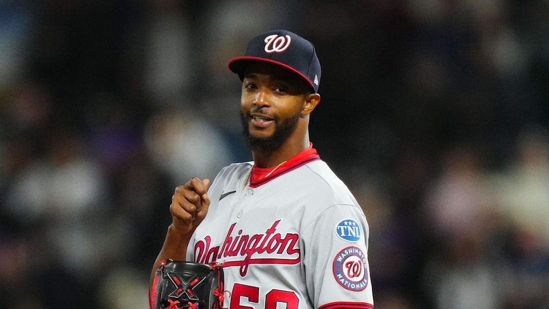 Apr 8, 2023; Denver, Colorado, USA; Washington Nationals relief pitcher Carl Edwards Jr. (58) reacts in the ninth inning against the Colorado Rockies at Coors Field. Mandatory Credit: Ron Chenoy-Imagn Images