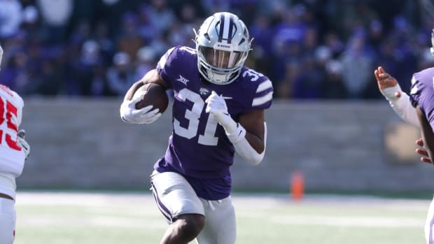 Kansas State Wildcats running back DJ Giddens on a rushing attempt during a college football game in the Big 12.