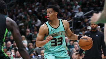 Apr 13, 2025; Boston, Massachusetts, USA; Charlotte Hornets guard Jaylen Sims (33) dribbles down the court during the second half against the Boston Celtics at TD Garden. Mandatory Credit: Paul Rutherford-Imagn Images