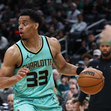 Apr 13, 2025; Boston, Massachusetts, USA; Charlotte Hornets guard Jaylen Sims (33) dribbles down the court during the second half against the Boston Celtics at TD Garden. Mandatory Credit: Paul Rutherford-Imagn Images