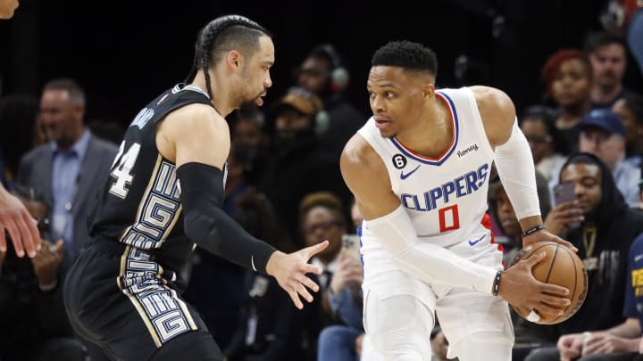 Los Angeles Clippers guard Russell Westbrook (0) handles the ball as Memphis Grizzlies forward Dillon Brooks (24) defends during the first half at FedExForum. Mandatory Credit: 