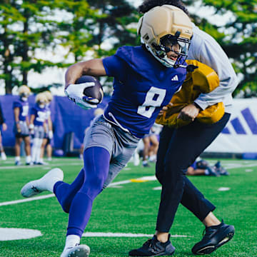 Chris Lawson wheels around a coach on the East practice field. 