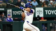 Aug 27, 2025; Arlington, Texas, USA;  Texas Rangers shortstop Corey Seager (5) hits a two-run home run during the fourth inning against the Los Angeles Angels at Globe Life Field. Mandatory Credit: Kevin Jairaj-Imagn Images