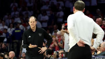 Former Husky basketball coach Mike Hopkins, shown here in Tucson coaching against Arizona, is moving to Phoenix. 