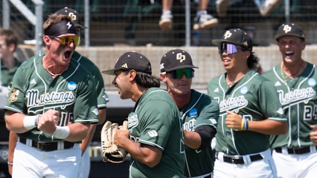 The Cal Poly Mustangs celebrate after defeating Oregon in an elimination game of the Eugene NCAA Regional at PK Park.