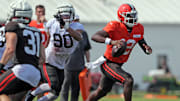 Cleveland Browns quarterback Shedeur Sanders runs for a short gain during NFL training camp ahead of the 2025 season