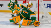 Jan 25, 2025; Saint Paul, Minnesota, USA; Minnesota Wild goaltender Marc-Andre Fleury (29) blocks the puck with his glove against the Calgary Flames in the third period at Xcel Energy Center. Mandatory Credit: Matt Blewett-Imagn Images