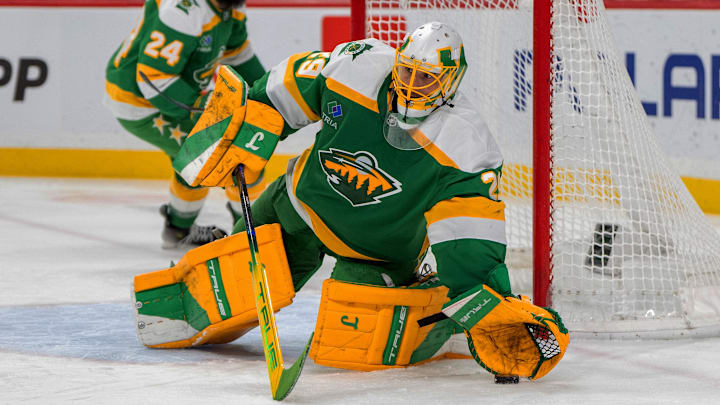 Jan 25, 2025; Saint Paul, Minnesota, USA; Minnesota Wild goaltender Marc-Andre Fleury (29) blocks the puck with his glove against the Calgary Flames in the third period at Xcel Energy Center. Mandatory Credit: Matt Blewett-Imagn Images
