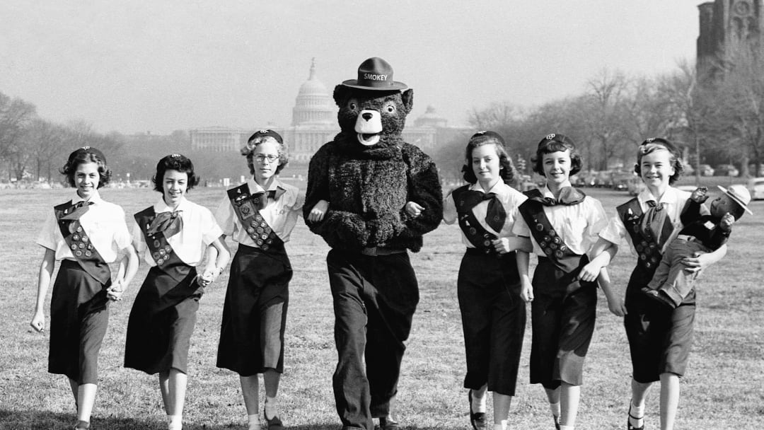 Smokey Bear with Girl Scouts in front of the U.S. Capitol.