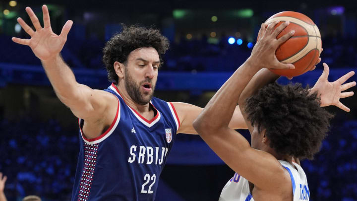 Jul 31, 2024; Villeneuve-d'Ascq, France; Serbia point guard Vasilije Micic (22) guards Puerto Rico guard Stephen Thompson Jr. (11) in the fourth quarter during the Paris 2024 Olympic Summer Games at Stade Pierre-Mauroy. Mandatory Credit: John David Mercer-USA TODAY Sports