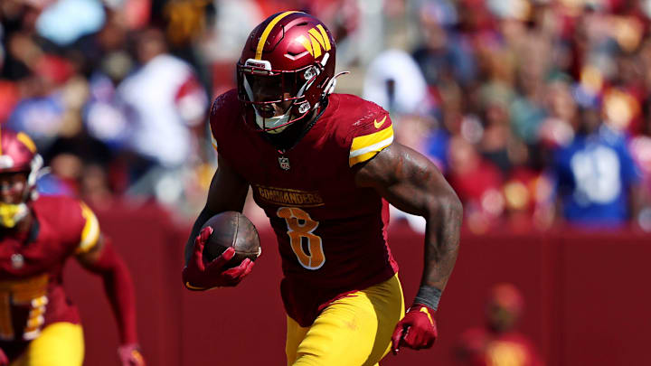 Sep 15, 2024; Landover, Maryland, USA; Washington Commanders running back Brian Robinson Jr. (8) runs the ball against the New York Giants at Commanders Field. Mandatory Credit: Peter Casey-Imagn Images