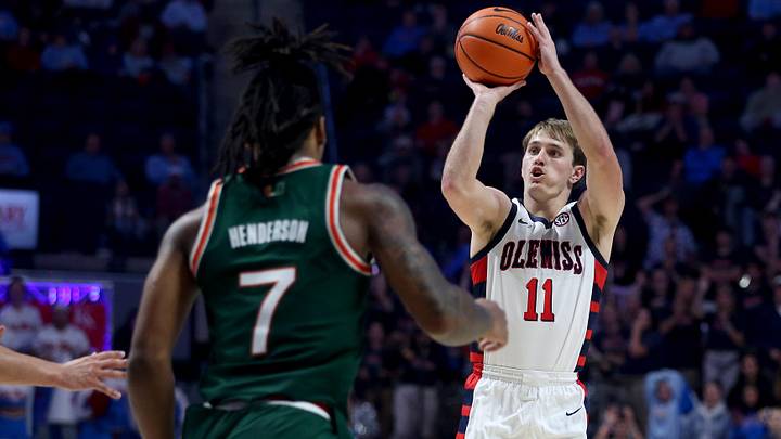 Dec 2, 2025; Oxford, Mississippi, USA; Mississippi Rebels guard Travis Perry (11) shoots for three during the second half against the Miami Hurricanes at The Sandy and John Black Pavilion at Ole Miss. Mandatory Credit: Petre Thomas-Imagn Images