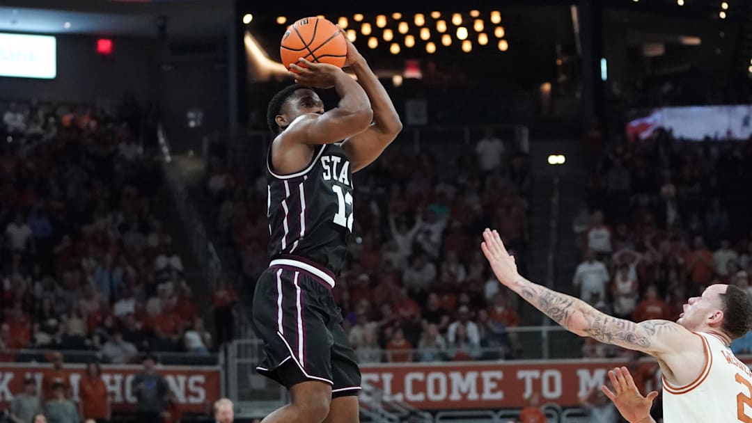 Mississippi State Bulldogs guard Josh Hubbard (12) shoots a three point basket against Texas Longhorns guard Chendall Weaver (2) during the second half at Moody Center. 