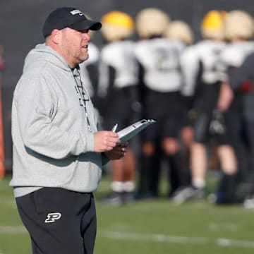 Purdue Boilermakers head coach Barry Odom looks down field 