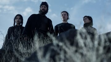 AMERICAN PRIMEVAL. (L to R) Shawnee Pourier as Two Moons, Taylor Kitsch as Isaac, Betty Gilpin as Sara Rowell and Preston Mota as Devin Rowell in Episode 102 of American Primeval. Cr. Courtesy of Netflix © 2024