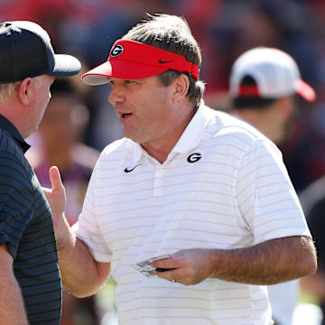 Georgia coach Kirby Smart speaks with Kentucky coach Mark Stoops before an NCAA college football game between Kentucky and Georgia in Athens, Ga., on Saturday, Oct. 16, 2021.

News Joshua L Jones