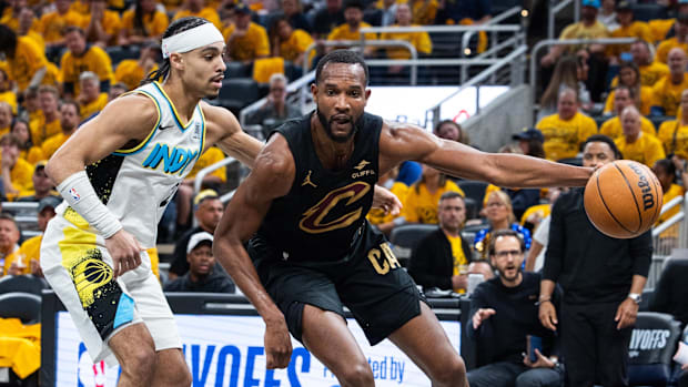Cleveland Cavaliers forward Evan Mobley (4) dribbles the ball while Indiana Pacers guard Andrew Nembhard (2) defends