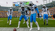 Carolina Panthers safety Nick Scott (21) and linebacker Maema Njongmeta (55) celebrate after Scott recovers a fumble against the Green Bay Packers on Sunday, November 2, 2025, at Lambeau Field in Green Bay, Wis. The Panthers won the game, 16-13, on a 49-yard field goal as time expired.
Tork Mason/USA TODAY NETWORK-Wisconsin