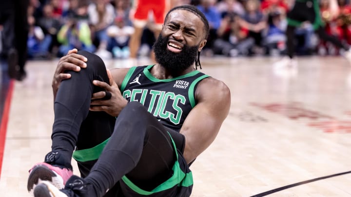 Mar 30, 2024; New Orleans, Louisiana, USA;  Boston Celtics guard Jaylen Brown (7) grabs his knee