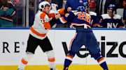 Nov 26, 2022; Elmont, New York, USA; Philadelphia Flyers defenseman Tony DeAngelo (77) fights New York Islanders right wing Oliver Wahlstrom (26) during the third period at UBS Arena. Mandatory Credit: Brad Penner-USA TODAY Sports