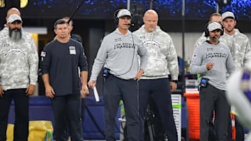 Nov 25, 2024; Inglewood, California, USA; Los Angeles Chargers head coach Jim Harbaugh watches game action against the Baltimore Ravens during the first half at SoFi Stadium. Mandatory Credit: Gary A. Vasquez-Imagn Images
