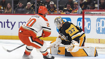 Dec 9, 2025; Pittsburgh, Pennsylvania, USA;  Pittsburgh Penguins goaltender Arturs Silovs (37) makes a save against Anaheim Ducks left wing Chris Kreider (20) during the second period at PPG Paints Arena. Mandatory Credit: Charles LeClaire-Imagn Images