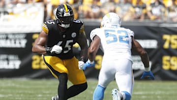 Sep 22, 2024; Pittsburgh, Pennsylvania, USA;  Pittsburgh Steelers offensive tackle Dan Moore Jr. (65) blocks Los Angeles Chargers linebacker Khalil Mack (52) at the line of scrimmage against at Acrisure Stadium. Mandatory Credit: Charles LeClaire-Imagn Images