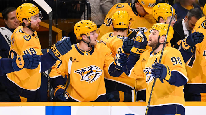 Feb 2, 2026; Nashville, Tennessee, USA;  Nashville Predators center Ryan O'Reilly (90) celebrates with his teammates after scoring a goal against the St. Louis Blues during the first period at Bridgestone Arena. Mandatory Credit: Steve Roberts-Imagn Images