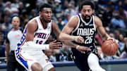 Mar 16, 2025; Dallas, Texas, USA;  Dallas Mavericks guard Spencer Dinwiddie (26) drives to the basket as Philadelphia 76ers forward Justin Edwards (19) defends during the first half at American Airlines Center. Mandatory Credit: Kevin Jairaj-Imagn Images