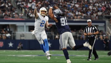 Aug 24, 2024; Arlington, Texas, USA; Los Angeles Chargers quarterback Easton Stick (2) throws a pass against Dallas Cowboys defensive lineman Viliami Fehoko (93) in the second quarter at AT&T Stadium. Mandatory Credit: Tim Heitman-USA TODAY Sports