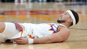Apr 11, 2025; Phoenix, Arizona, USA; Phoenix Suns guard Devin Booker (1) reacts after making a basket and being fouled against the San Antonio Spurs during the second half at Footprint Center. Mandatory Credit: Joe Camporeale-Imagn Images