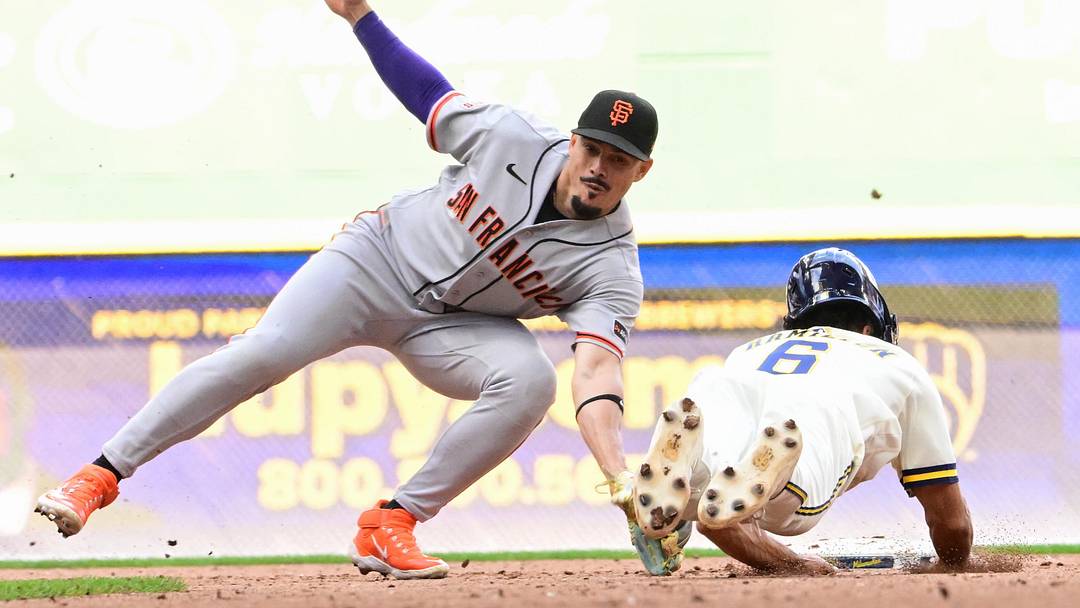 Jun 4, 2026; Milwaukee, Wisconsin, USA;  San Francisco Giants shortstop Willy Adames (2) tags out Milwaukee Brewers shortstop David Hamilton (6) trying to steal second base in the sixth inning at American Family Field. Mandatory Credit: Benny Sieu-Imagn Images