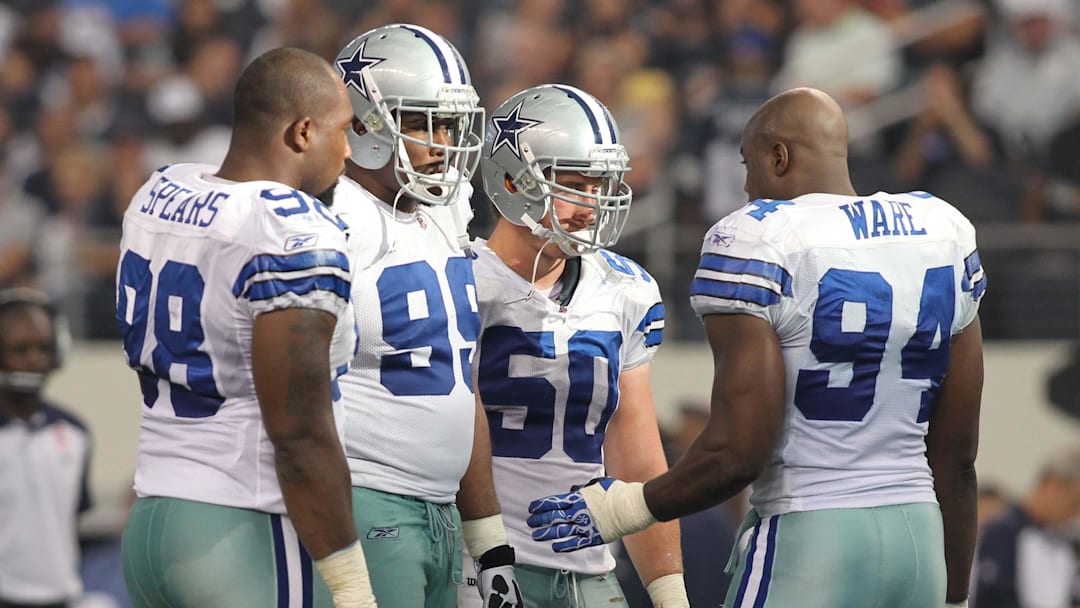 Oct 23, 2011; Arlington, TX, USA; Dallas Cowboys defensive end Marcus Spears (98), defensive end Kenyon Coleman (99), linebacker Sean Lee (50) and linebacker DeMarcus Ware talk during a timeout in the third quarter of the game against the St Louis Rams at Cowboys Stadium. The Cowboys beat the Rams 34-7. Mandatory Credit: Tim Heitman-Imagn Images