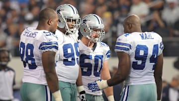 Oct 23, 2011; Arlington, TX, USA; Dallas Cowboys defensive end Marcus Spears (98), defensive end Kenyon Coleman (99), linebacker Sean Lee (50) and linebacker DeMarcus Ware talk during a timeout in the third quarter of the game against the St Louis Rams at Cowboys Stadium. The Cowboys beat the Rams 34-7. Mandatory Credit: Tim Heitman-Imagn Images
