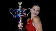 Aryna Sabalenka holds the 2024 Australian Open trophy after winning the tournament.