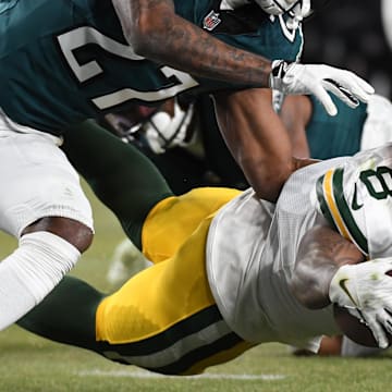 Green Bay Packers running back Josh Jacobs (8) dives for the end zone Philadelphia Eagles cornerback Quinyon Mitchell.