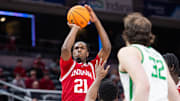 Mar 13, 2025; Indianapolis, IN, USA; Indiana Hoosiers forward Mackenzie Mgbako (21) shoots the ball while Oregon Ducks guard TJ Bamba (5) defends in the first half at Gainbridge Fieldhouse. Mandatory Credit: Trevor Ruszkowski-Imagn Images
