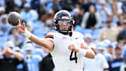 Oct 25, 2025; Chapel Hill, North Carolina, USA; Virginia Cavaliers quarterback Chandler Morris (4) looks to pass in the fourth quarter at Kenan Stadium. Mandatory Credit: Bob Donnan-Imagn Images