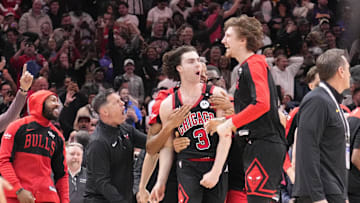 Mar 27, 2025; Chicago, Illinois, USA; Chicago Bulls guard Josh Giddey (3) celebrates with teammates after making the game-winning three point basket against the Los Angeles Lakers during the second half at United Center. Mandatory Credit: David Banks-Imagn Images