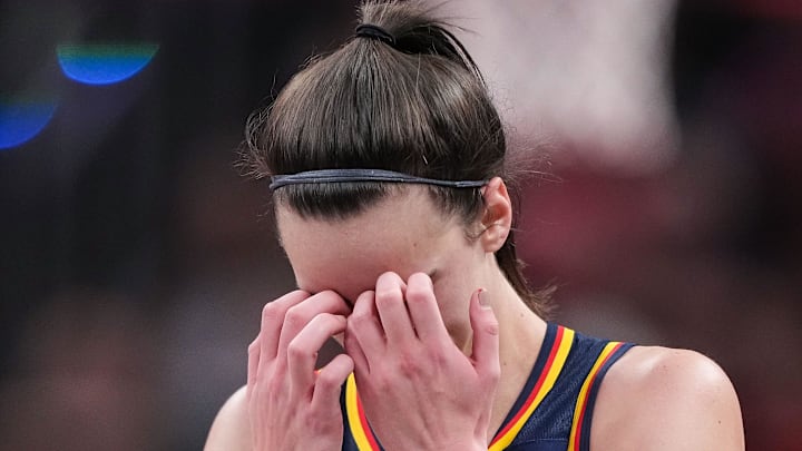 Indiana Fever guard Caitlin Clark (22) rubs her face in disappointment Wednesday, Sept. 4, 2024, during the game at Gainbridge Fieldhouse in Indianapolis. The Indiana Fever defeated the Los Angeles Sparks, 93-86.