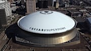 Feb 14, 2022; New Orleans, Louisiana, USA;  Detailed view of the Caesars Superdome and Smoothie King Center from outside before the game between the Toronto Raptors at New Orleans Pelicans at the Smoothie King Center.