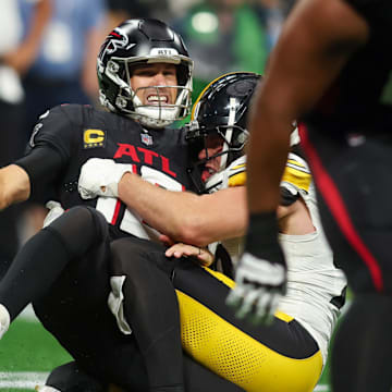 Sep 8, 2024; Atlanta, Georgia, USA; Pittsburgh Steelers linebacker T.J. Watt (90) tackles Atlanta Falcons quarterback Kirk Cousins (18) in the third quarter at Mercedes-Benz Stadium.