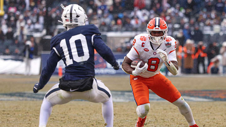 Dec 27, 2025; Bronx, NY, USA; Clemson Tigers running back Adam Randall (8) looks to gain yards after a catch as Penn State Nittany Lions safety Dejuan Lane (10) pursues during the first half of the 2025 Pinstripe Bowl at Yankee Stadium. Mandatory Credit: Vincent Carchietta-Imagn Images