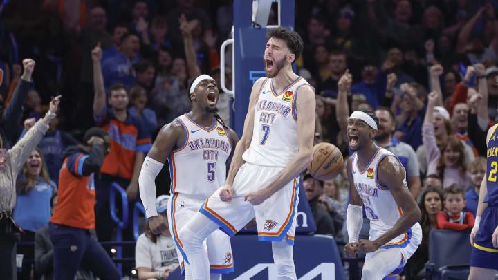 Dec 8, 2023; Oklahoma City, Oklahoma, USA; Oklahoma City Thunder forward Chet Holmgren (7), guard Luguentz Dort (5) and guard Shai Gilgeous-Alexander (2) celebrate after Chet Holmgren scores a basket against the Golden State Warriors during the second half at Paycom Center. Mandatory Credit: Alonzo Adams-USA TODAY Sports