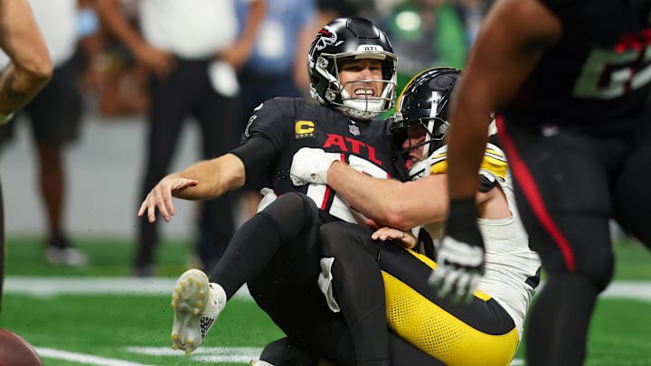 Sep 8, 2024; Atlanta, Georgia, USA; Pittsburgh Steelers linebacker T.J. Watt (90) tackles Atlanta Falcons quarterback Kirk Cousins (18) in the third quarter at Mercedes-Benz Stadium.